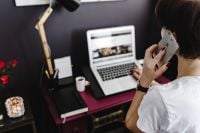 Kaboompics - Woman Taking a Phone Call at Her Home Office Desk