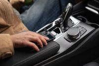 Kaboompics - Woman's Hand on a Car Center Console