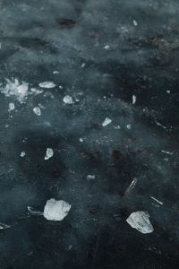 Kaboompics - Translucent Ice Fragments on Dark Winter Water