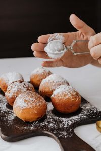 Kaboompics - Homemade Polish doughnuts with cherry filling, covered with powdered sugar. Traditional speciality on Fat Thursday in Poland.