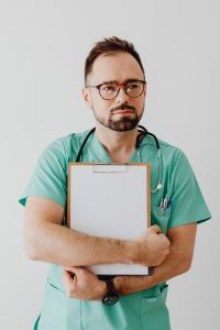 Kaboompics - Doctor Standing With Stethoscope and Clipboard