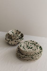 Kaboompics - Green Splatter Bowls and Plates with Tall Neutral Copy Space