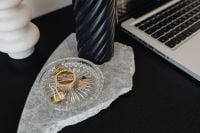 Kaboompics - Laptop Desk with Black Candle and Gold Binder Clips on Marble, Home Office Flat Lay