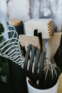 Kitchen utensils and cans by the wall
