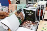 Kaboompics - A man thumbing through a book