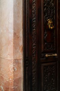 Kaboompics - Carved Wooden Door with Marble Frame