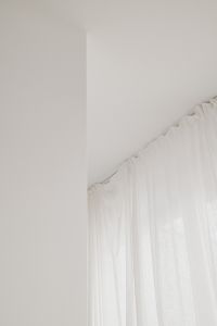 Kaboompics - White Sheer Curtain and Minimalist Wall Detail – Fujifilm X100VI
