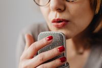 Kaboompics - Close-Up Red-Nailed Hand Touching a Microphone during ASMR Recording