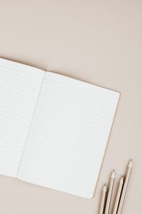 Kaboompics - Open Lined Notebook with Pencil