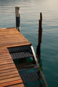 Kaboompics - Lakeside Dock Steps Descending Into Calm Blue Water