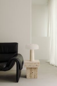Kaboompics - Black Leather De Sede Sofa with Travertine Side Table and Lamp