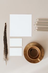 Kaboompics - Blank Brand Card Mockup with Pencils, Feather and Ceramic Plate