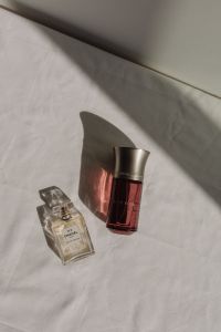 Kaboompics - Chanel No. 5 Perfume and Dom Rosa Bottle with Strong Shadows