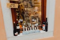 Kaboompics - Shop Window Display with Bottles and Local Products in Rovinj