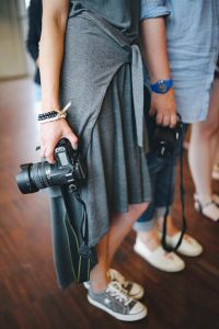 Kaboompics - People holding cameras