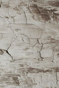 Kaboompics - Vertical Beige Cracked Paint Texture with Layered Brush Strokes