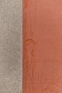 Kaboompics - Granite Edge Meeting Red Painted Wall
