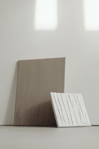 Kaboompics - Neutral Paint Sample Boards Against a Sunlit Wall