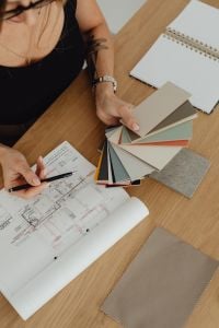 Kaboompics - Interior Designer Choosing Paint Colors for an Architectural Floor Plan