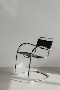 Kaboompics - Angled Chrome-Frame Armchair with Strong Shadows