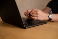 Kaboompics - Man Using a Laptop with a Stylus