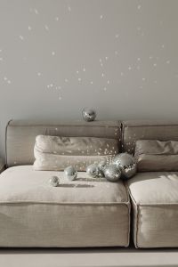 Kaboompics - Wide Gray Sofa with Disco Balls on Backrest and Seat