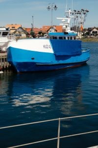 Kaboompics - Blue Fishing Boat Moored in Harbor