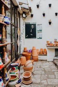 Kaboompics - Stacked Terracotta Pots Outside a Shopfront