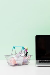 Kaboompics - Shopping Basket and Smartphone on Mint Green Background with Copy Space