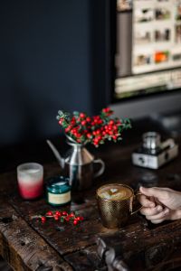 Kaboompics - Cup of coffee, Fresh Holly and Candles