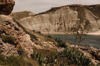 Kaboompics - Eroded Limestone Cliffs Above a Quiet Malta Cove