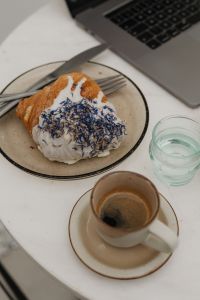 Kaboompics - Laptop, Blue Sprinkle Croissant and Espresso Close-Up
