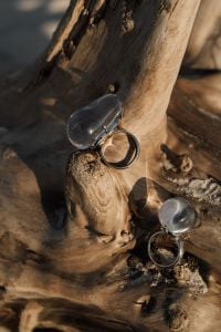 Kaboompics - Two Silver Statement Rings on Weathered Driftwood
