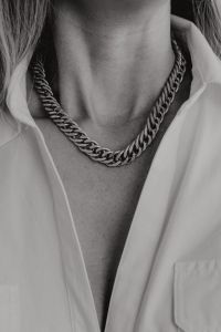 Kaboompics - Black and White Close-Up of Chain Necklace and White Shirt