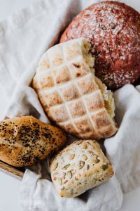 Kaboompics - Beetroot and Classic Slovenian Breads on Linen, Rustic Bakery Assortment