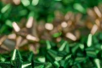 Kaboompics - Blurred Green and Gold Gift Bow Background