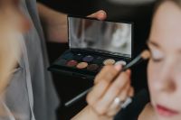 Kaboompics - A woman putting on make-up
