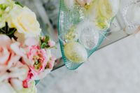 Kaboompics - Clear Glass Easter Egg Ornaments Nestled among Spring Flowers, Delicate Holiday Styling