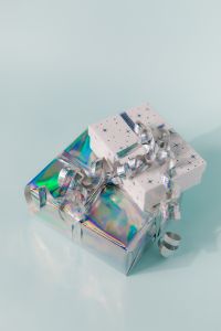Kaboompics - Holographic and White Gift Boxes with Silver Ribbon