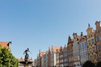 Kaboompics - Gdańsk Poland Old Town Townhouses and Neptune Fountain Statue Under Blue Sky
