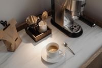 Kaboompics - Overhead Coffee Bar with Espresso Machine and White Cup