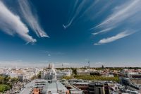 Kaboompics - Palacio de Cibeles and Central Madrid Rooftops Beneath Wispy Blue-Sky Clouds