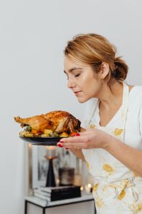 Kaboompics - Woman Holding a Thanksgiving Turkey Platter at the Table