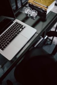 Kaboompics - Organized desk with laptop and journals