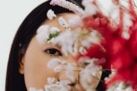 Kaboompics - Soft-Focus Flower Foreground Framing an Asian Beauty Portrait with Floral Eyebrow Makeup