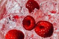Kaboompics - Raspberries Floating In Ice Water Close Up