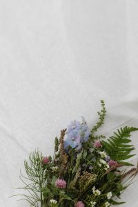 Kaboompics - Wildflower Arrangement in Lower Corner with White Fabric Copy Space