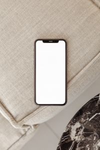 Kaboompics - Blank Smartphone Screen Mockup on Textured Beige Fabric