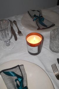 Kaboompics - Overhead Candlelit Table with Teal Bow Napkin
