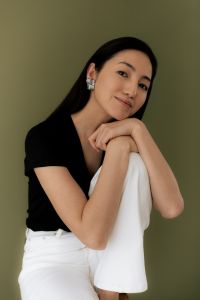 Kaboompics - Smiling Woman in Black Top and White Pants